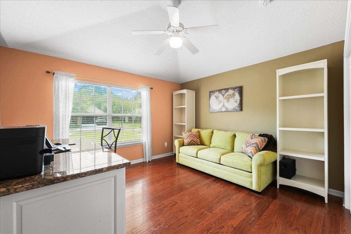 880 East Red House Branch Road St. Augustine, FL 32084 - Photo 24 of 65 a living room with furniture and a flat screen tv