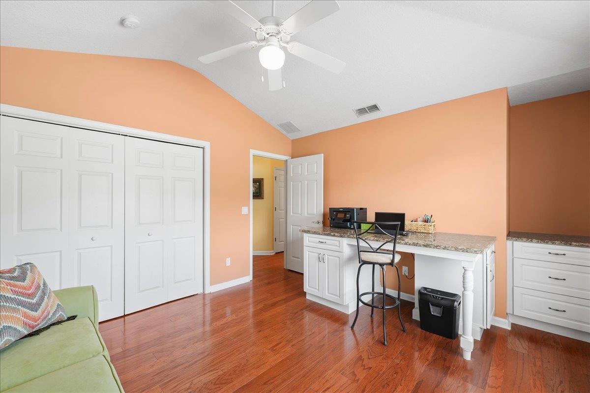 880 East Red House Branch Road St. Augustine, FL 32084 - Photo 25 of 65 a view of a workspace with furniture and wooden floor