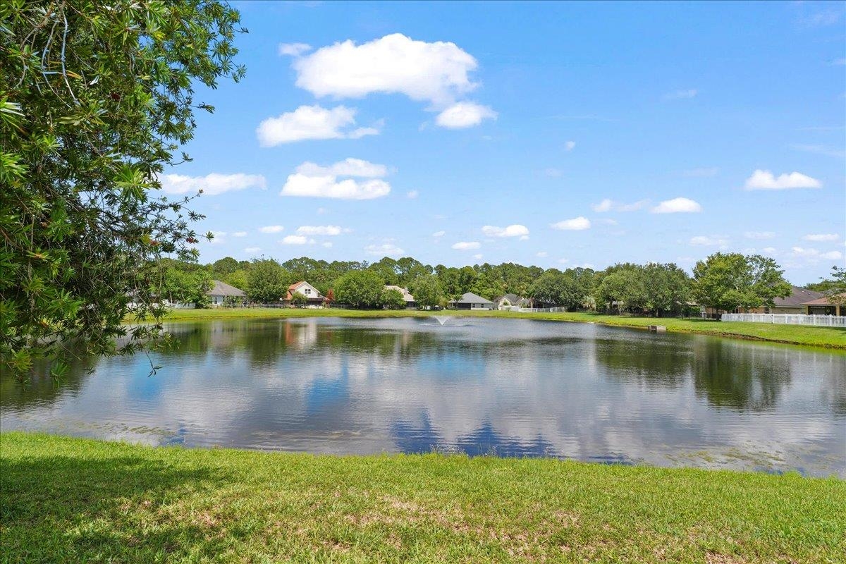 880 East Red House Branch Road St. Augustine, FL 32084 - Photo 3 of 65 a body of water with a tree in the background
