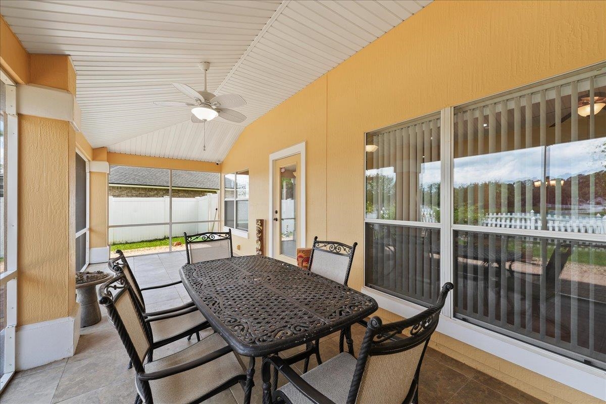 880 East Red House Branch Road St. Augustine, FL 32084 - Photo 32 of 65 a view of a patio with a table and chairs