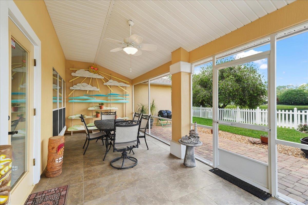 880 East Red House Branch Road St. Augustine, FL 32084 - Photo 33 of 65 a dining room with furniture and a floor to ceiling window