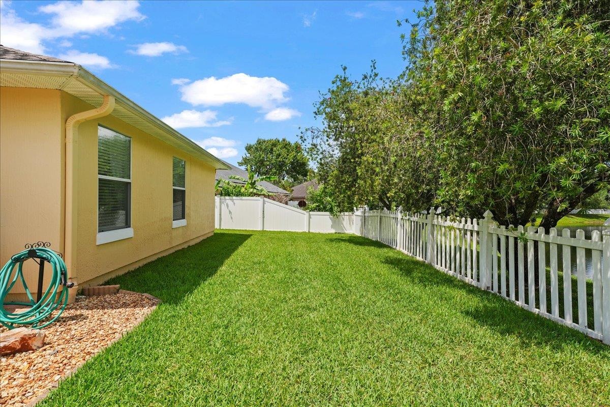 880 East Red House Branch Road St. Augustine, FL 32084 - Photo 35 of 65 a view of a backyard with wooden fence