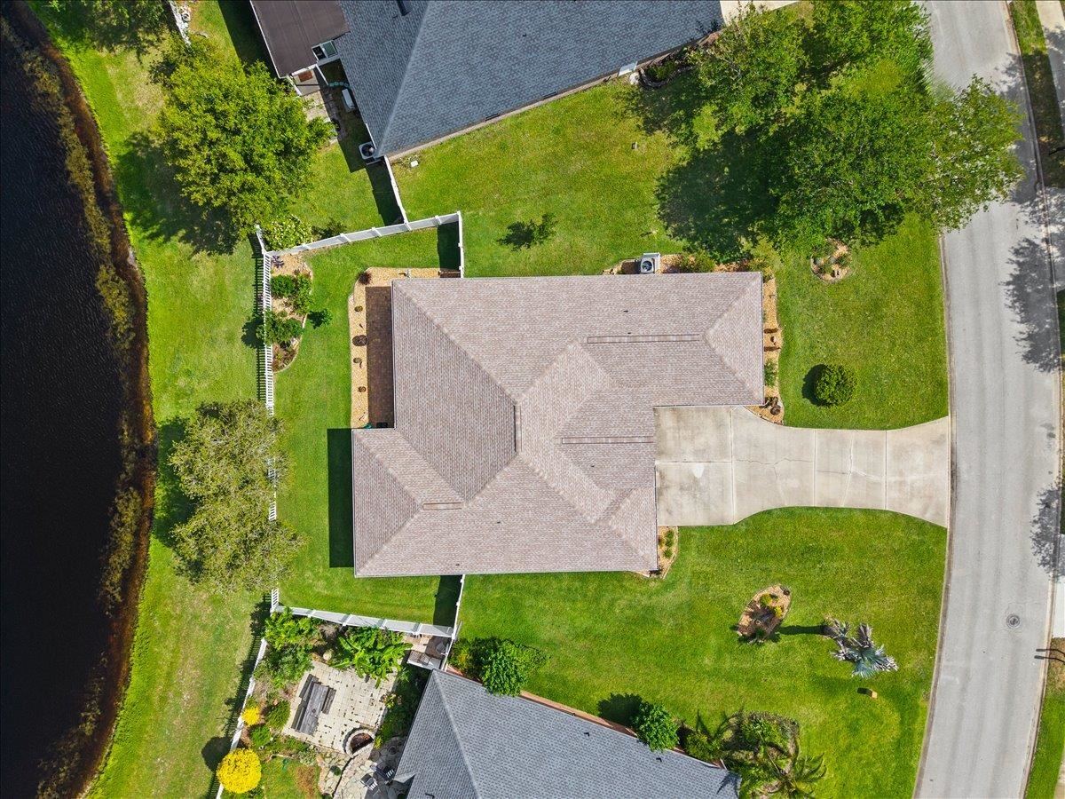 880 East Red House Branch Road St. Augustine, FL 32084 - Photo 40 of 65 an aerial view of a house with a yard