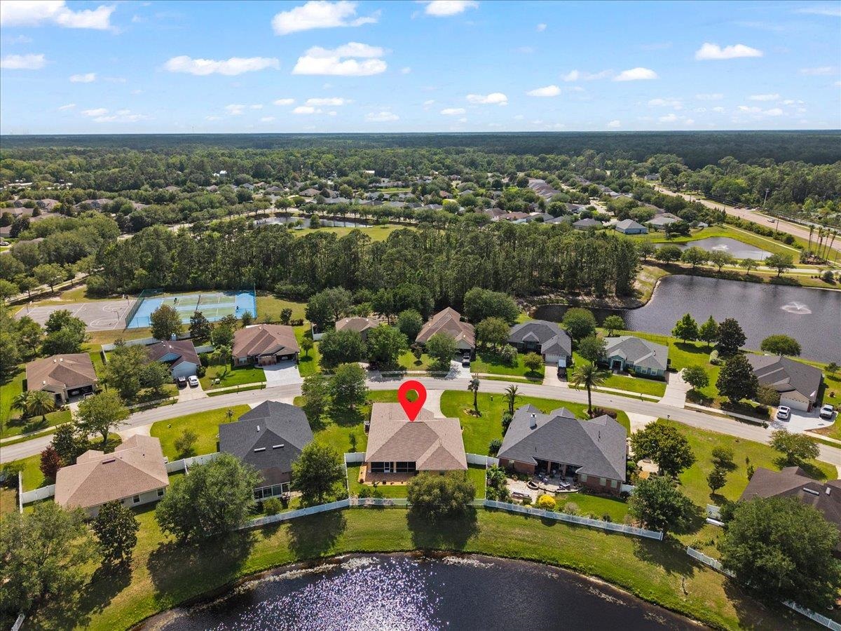 880 East Red House Branch Road St. Augustine, FL 32084 - Photo 44 of 65 an aerial view of residential houses with outdoor space and swimming pool