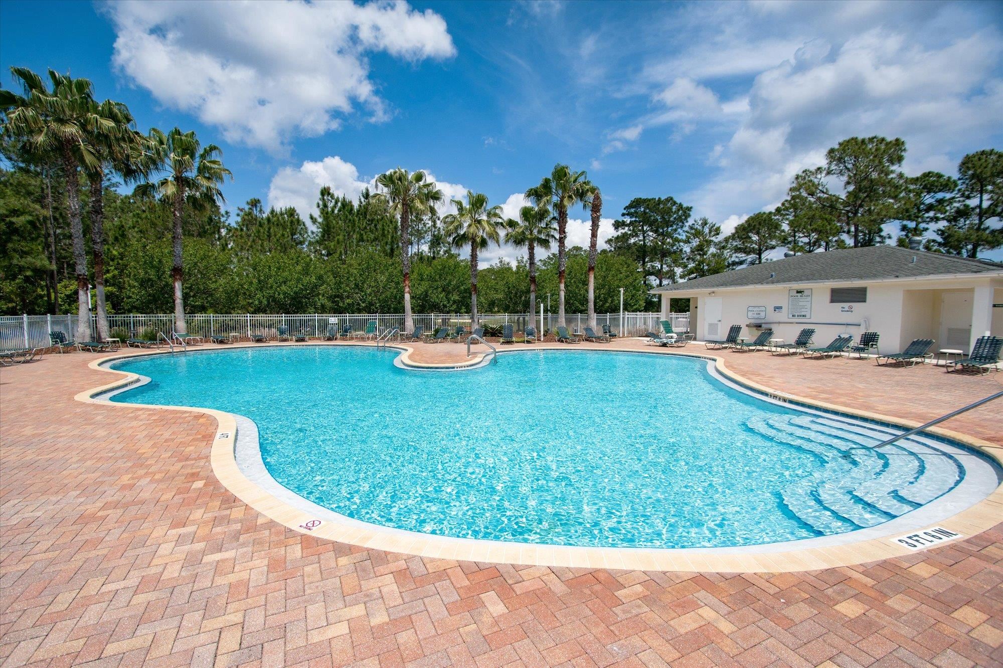 880 East Red House Branch Road St. Augustine, FL 32084 - Photo 54 of 65 a view of a swimming pool with a patio