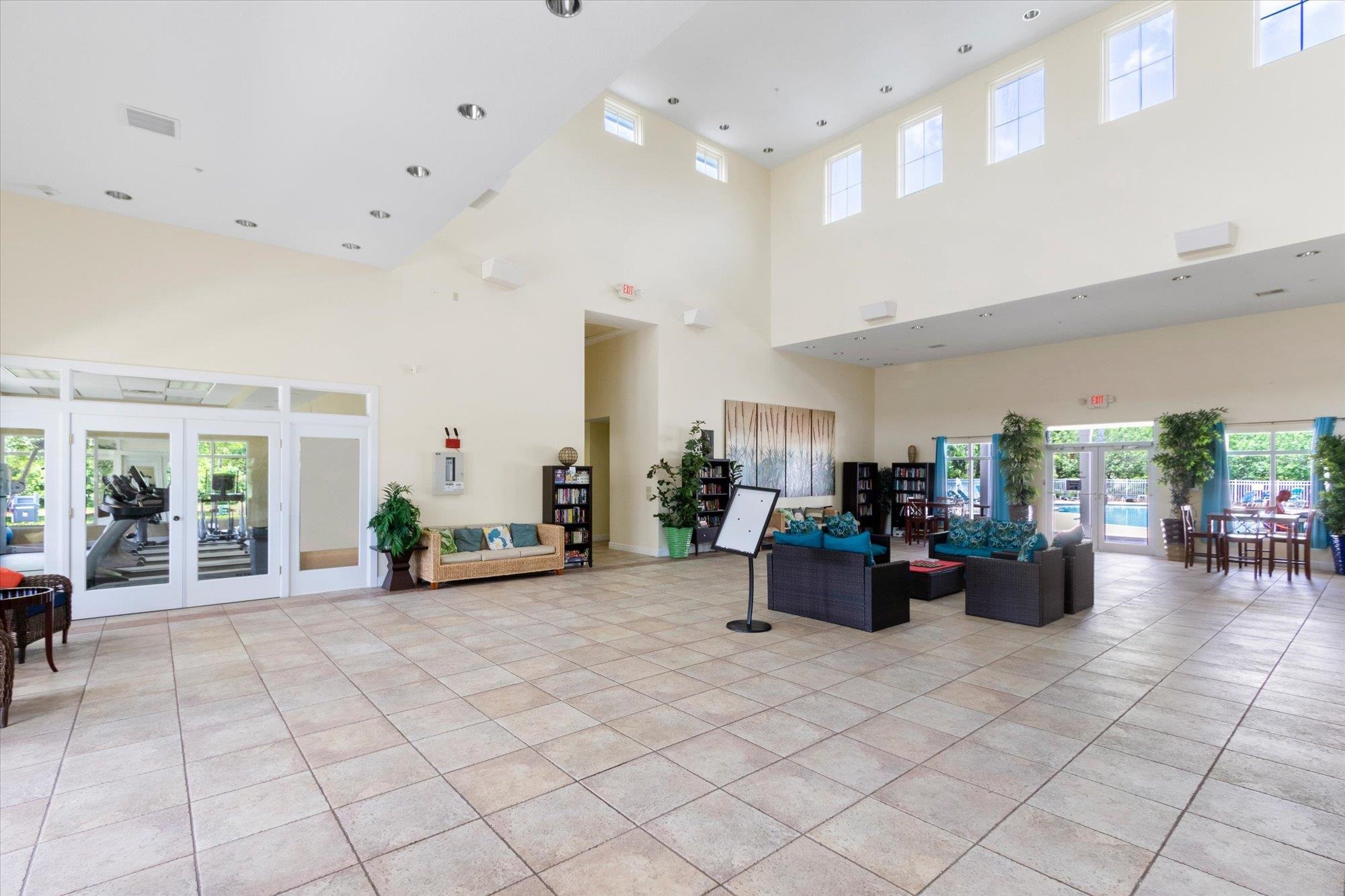 880 East Red House Branch Road St. Augustine, FL 32084 - Photo 57 of 65 a living room with furniture and potted plants