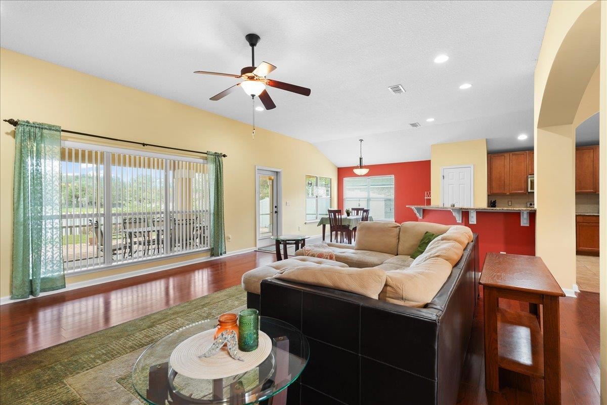 880 East Red House Branch Road St. Augustine, FL 32084 - Photo 10 of 65 a living room with furniture and a large window