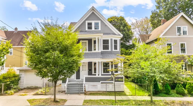 a front view of a house with a porch