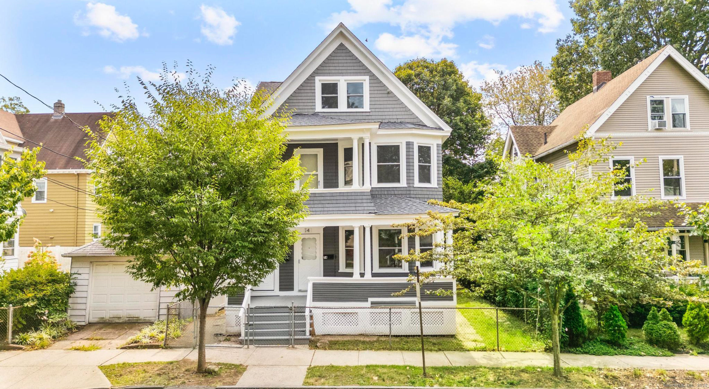 a front view of a house with a porch