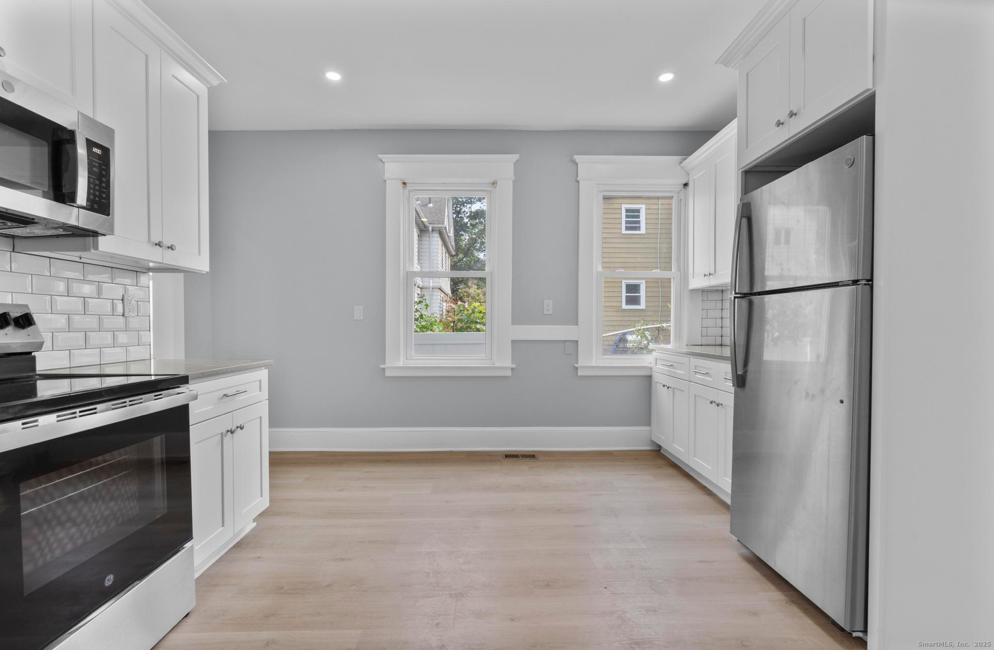 74 4th Street New Haven, CT 06519 - Photo 4 of 12 a kitchen with a refrigerator stove and microwave