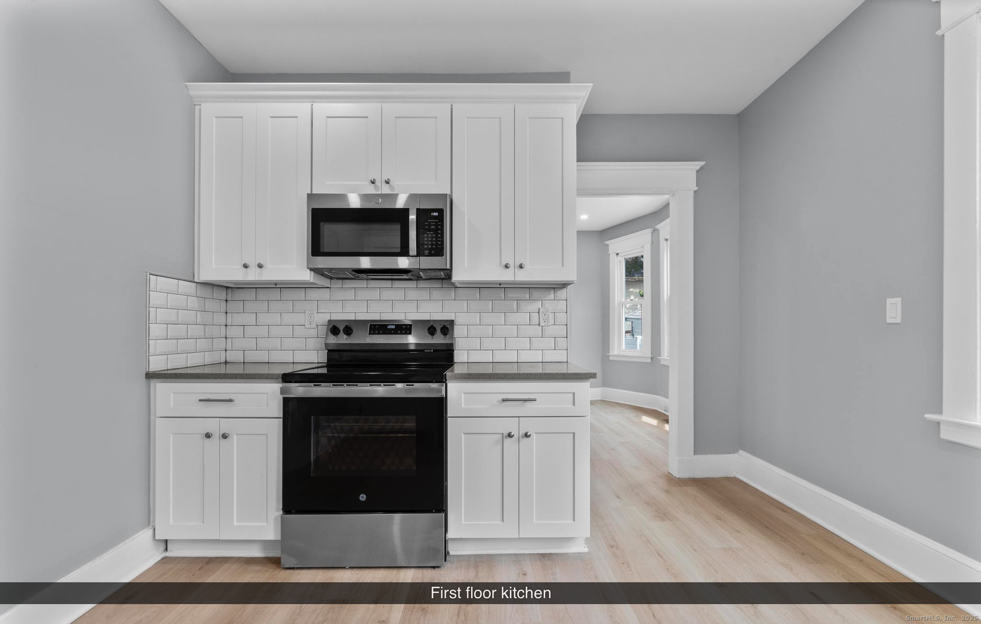 74 4th Street New Haven, CT 06519 - Photo 5 of 12 a kitchen with stainless steel appliances granite countertop a stove and a sink