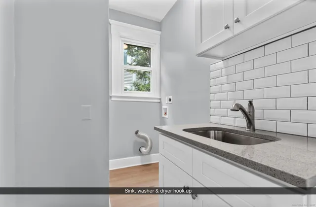 a kitchen with a sink and cabinets
