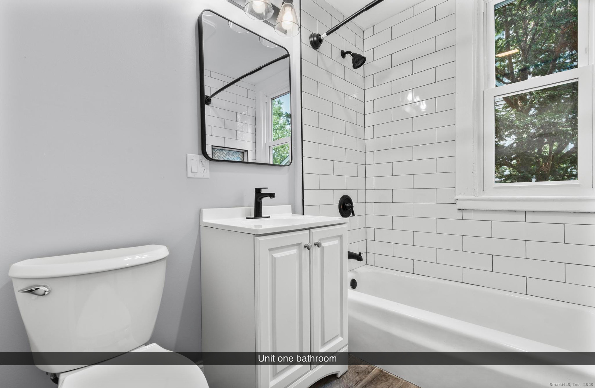 74 4th Street New Haven, CT 06519 - Photo 8 of 12 a bathroom with a toilet a sink and bathtub