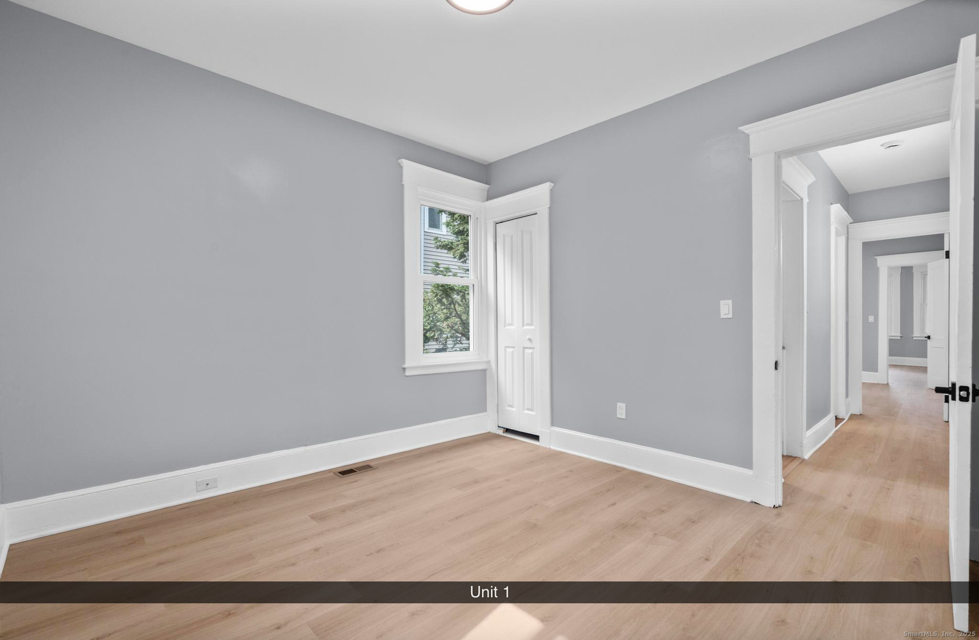 74 4th Street New Haven, CT 06519 - Photo 9 of 12 an empty room with wooden floor and windows