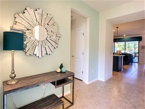 a view of a room with a table and a potted plant
