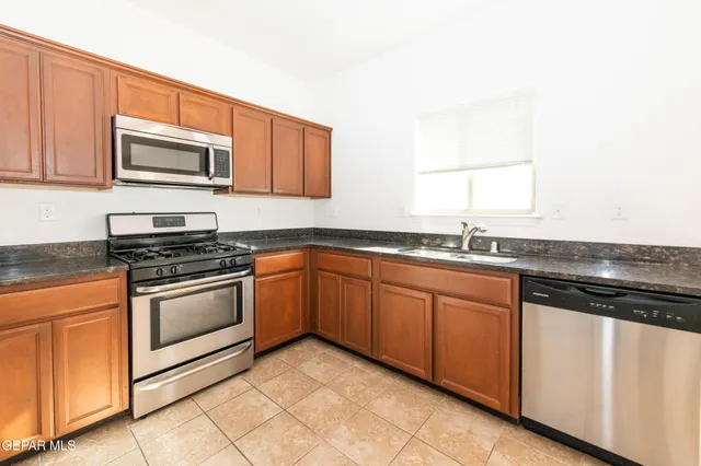a view of a house with a snow in the yard