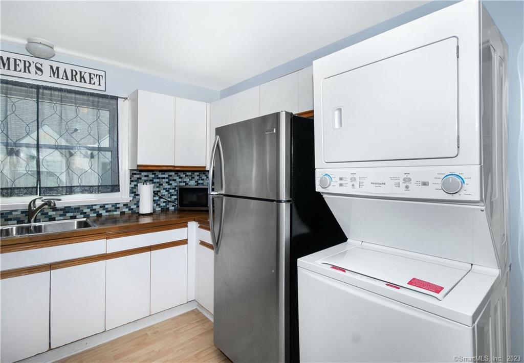 64 East Avenue New Canaan, CT 06840 - Photo 14 of 23 second floor unit kitchen has stackable laundry