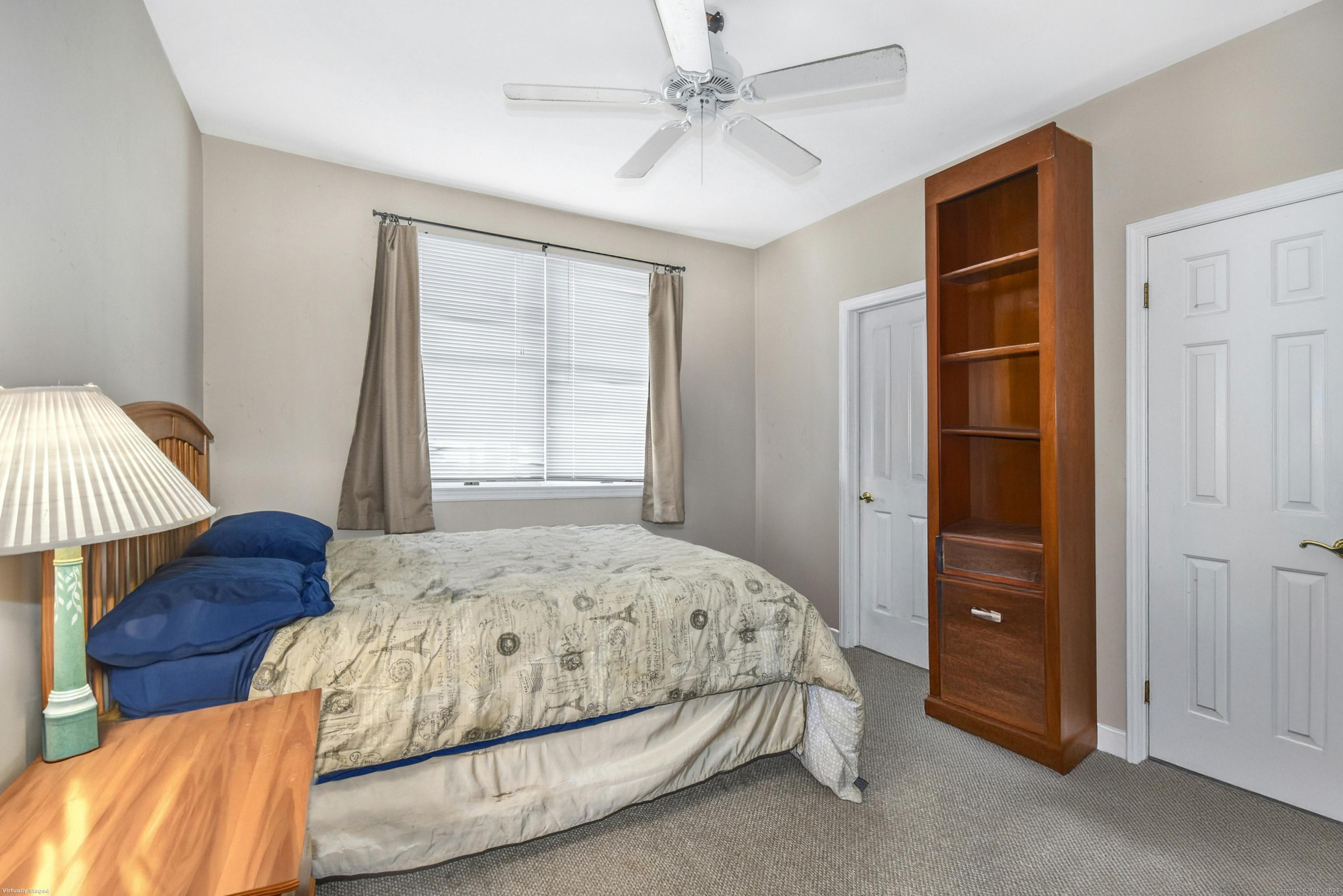 64 East Avenue New Canaan, CT 06840 - Photo 8 of 23 First floor unit bedroom with closet and large windows.