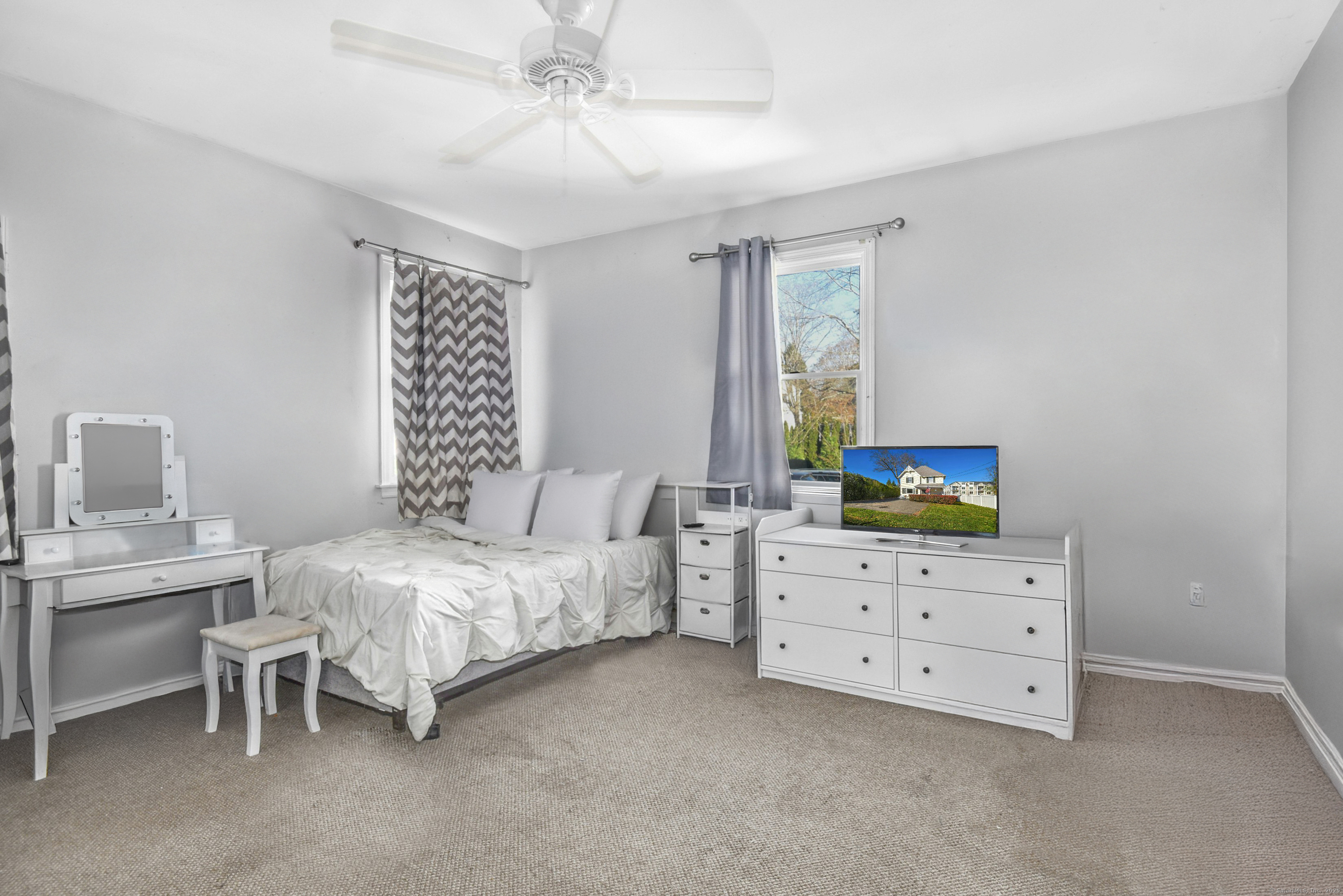 64 East Avenue New Canaan, CT 06840 - Photo 9 of 23 First floor primary corner bedroom with multiple windows allowing 2 exposures
