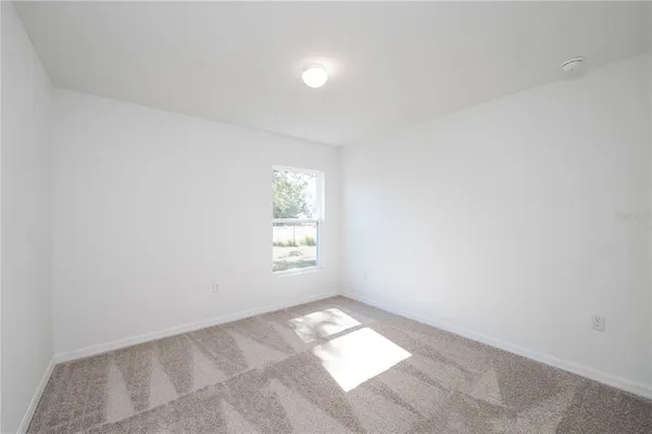 a view of an empty room and window
