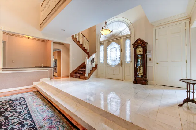 a view of an entryway with wooden floor