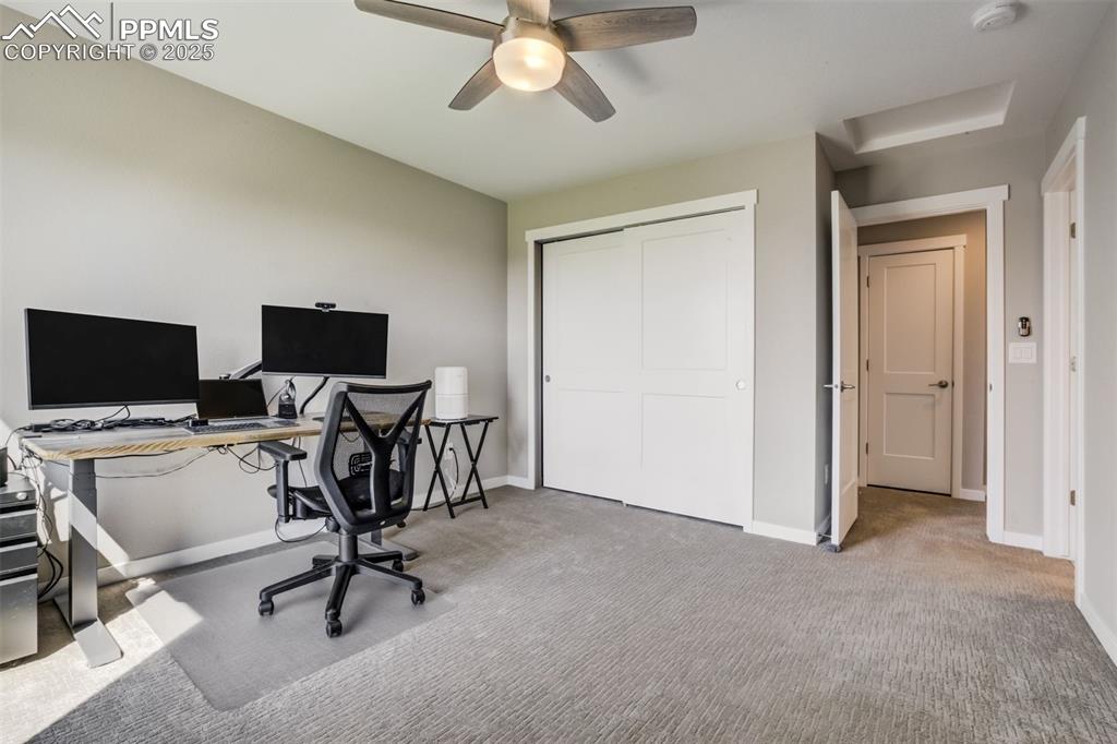 1325 Sunshine Vly Way Colorado Springs, CO 80921 - Photo 29 of 45 a view of a livingroom with workspace and a window