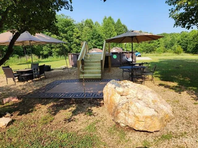 a view of backyard with staircase and wooden floor