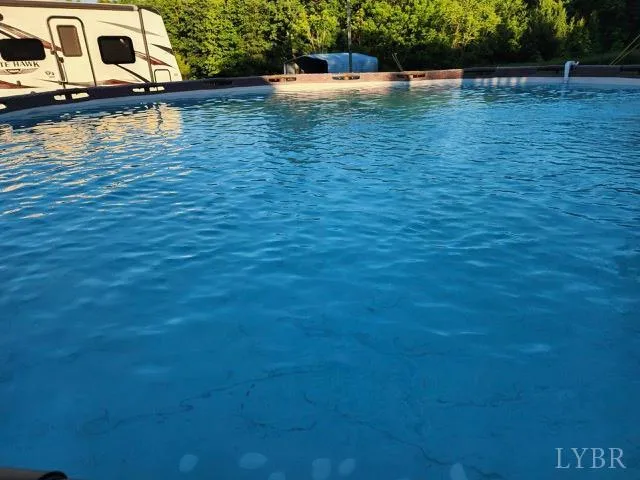 a view of house with swimming pool