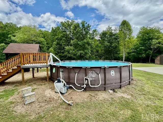 a view of a wooden deck with a yard