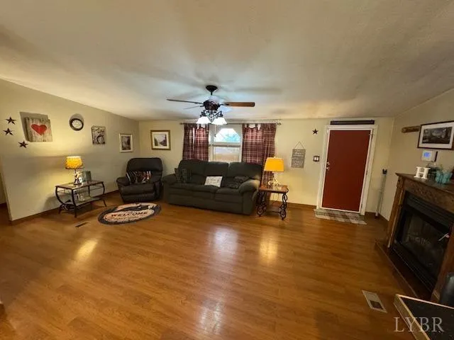a view of a livingroom with furniture and a flat screen tv