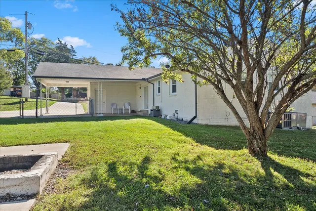 a view of a house with a yard