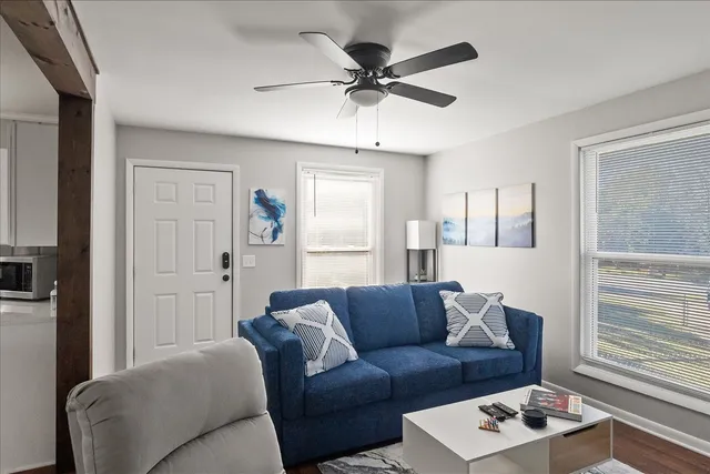 a living room with furniture and a window