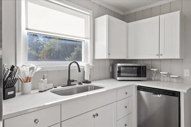 a kitchen with a sink and a microwave