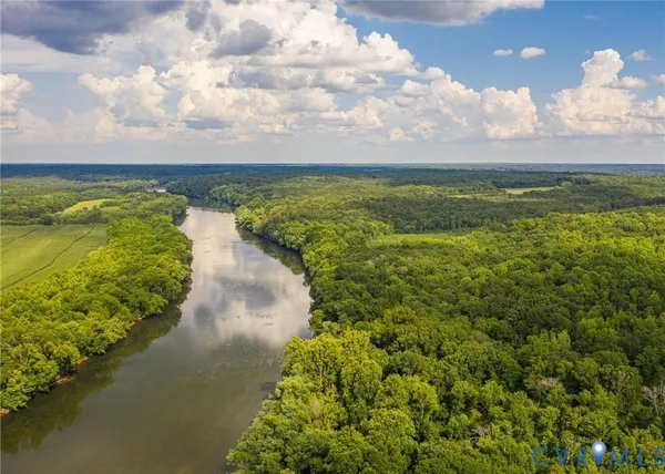 a view of a lake with a yard