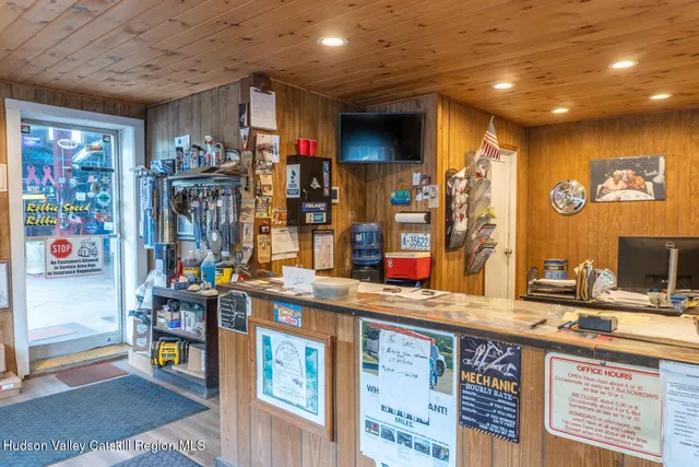 a kitchen filled with stainless steel appliances kitchen island granite countertop a sink and cabinets