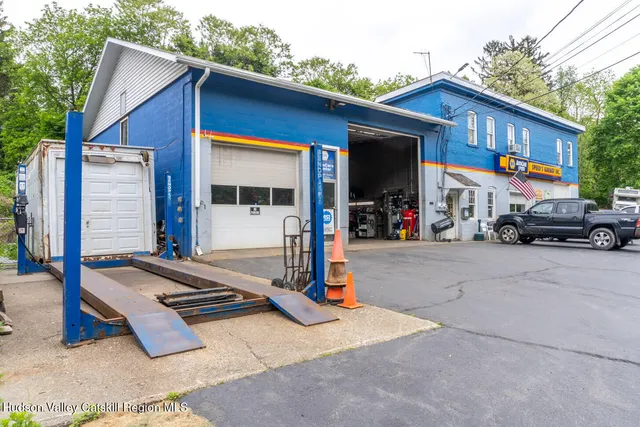 a view of a car park in front of house