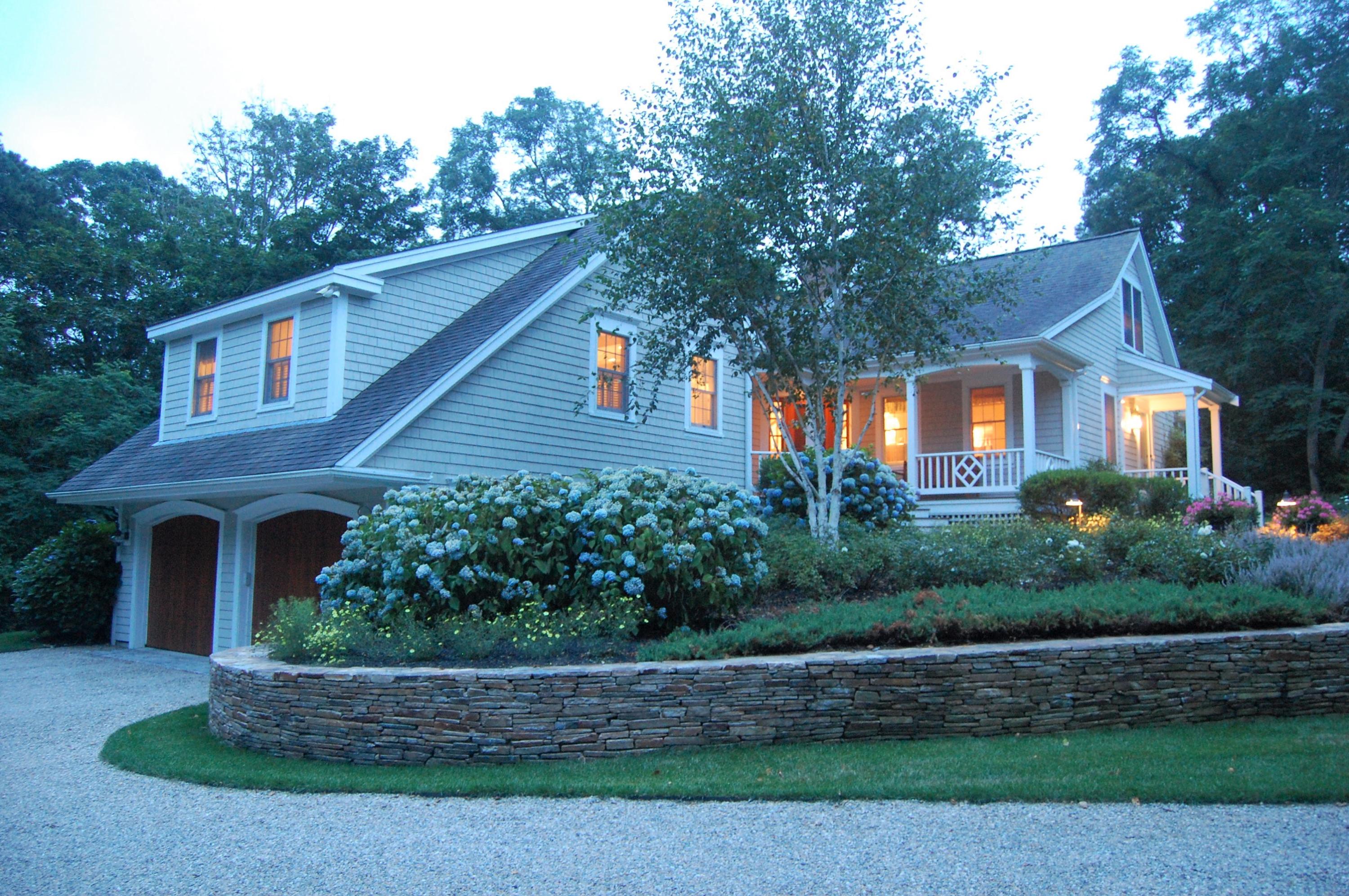 57 Beach Road Orleans, MA 02653 - Photo 19 of 24 a front view of a house with a garden