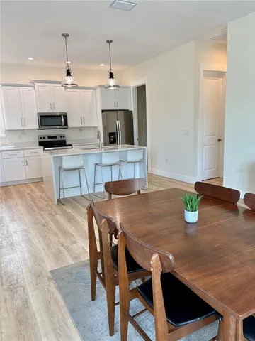 a kitchen with stainless steel appliances granite countertop a sink and cabinets