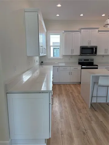 a kitchen with a sink and cabinets