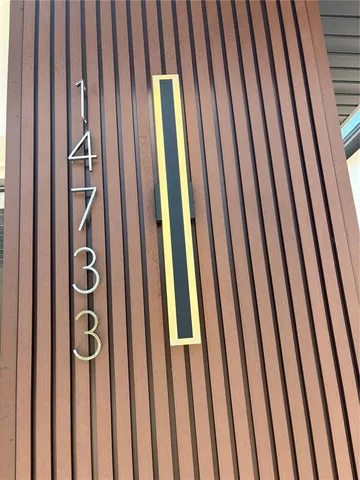 a view of a bedroom with wooden floor and closet