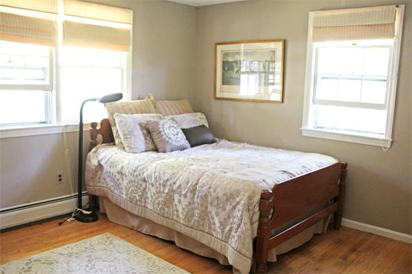 13 Harriman Road Merrimac, MA 01860 - Photo 13 of 18 a bed sitting in a bedroom next to a window