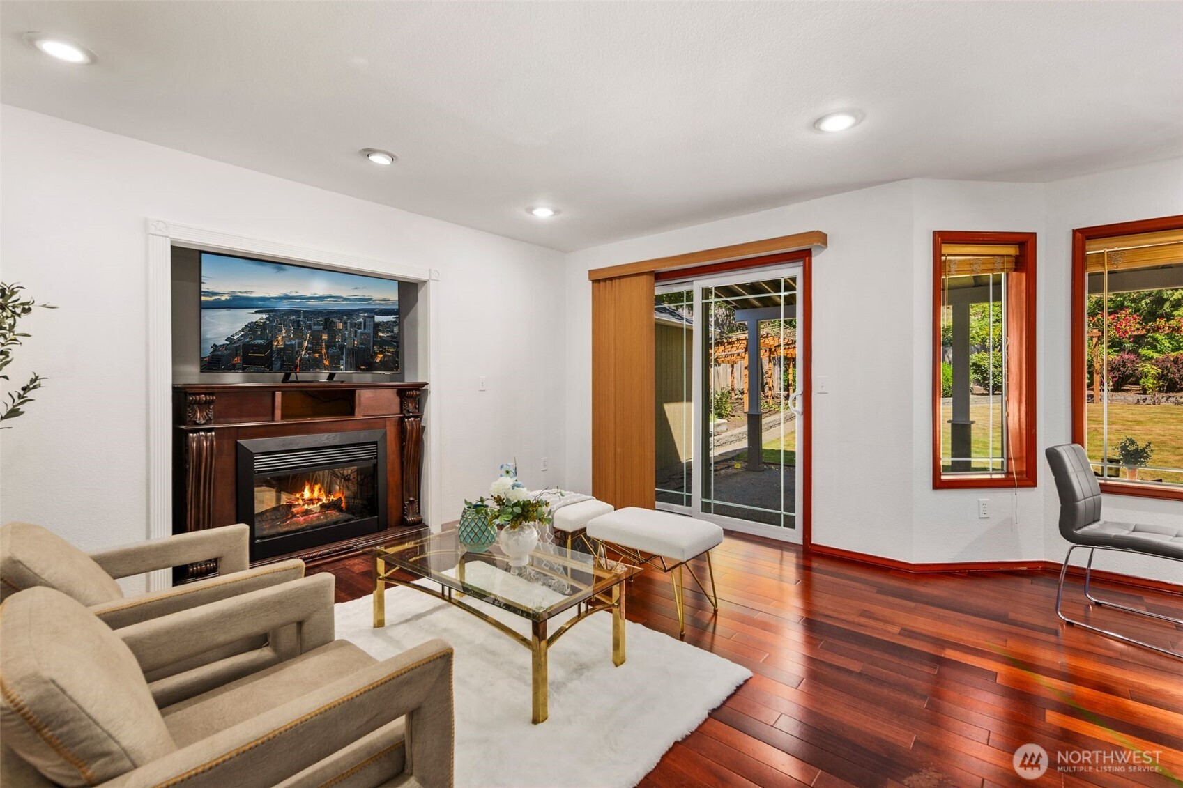 14015 Southeast 156th Court Renton, WA 98058 - Photo 18 of 36 a living room with furniture a fireplace and a floor to ceiling window