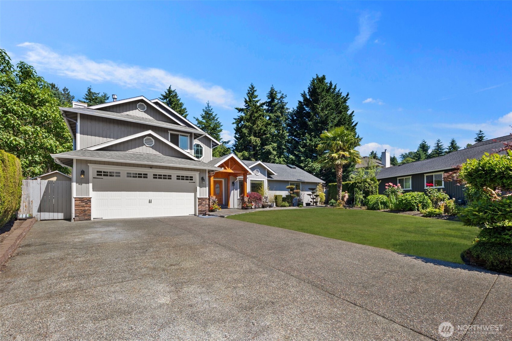 14015 Southeast 156th Court Renton, WA 98058 - Photo 2 of 36 a front view of a house with a yard