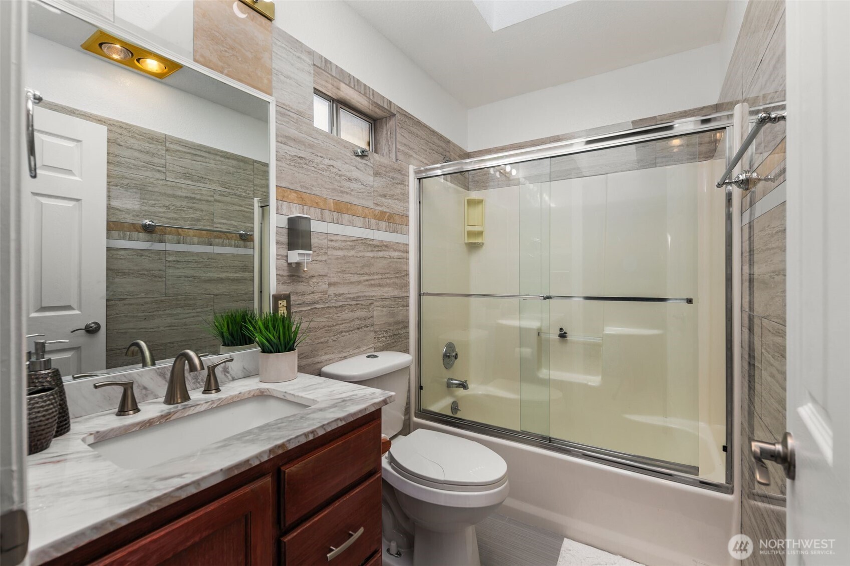 14015 Southeast 156th Court Renton, WA 98058 - Photo 22 of 36 a bathroom with a granite countertop sink toilet and shower