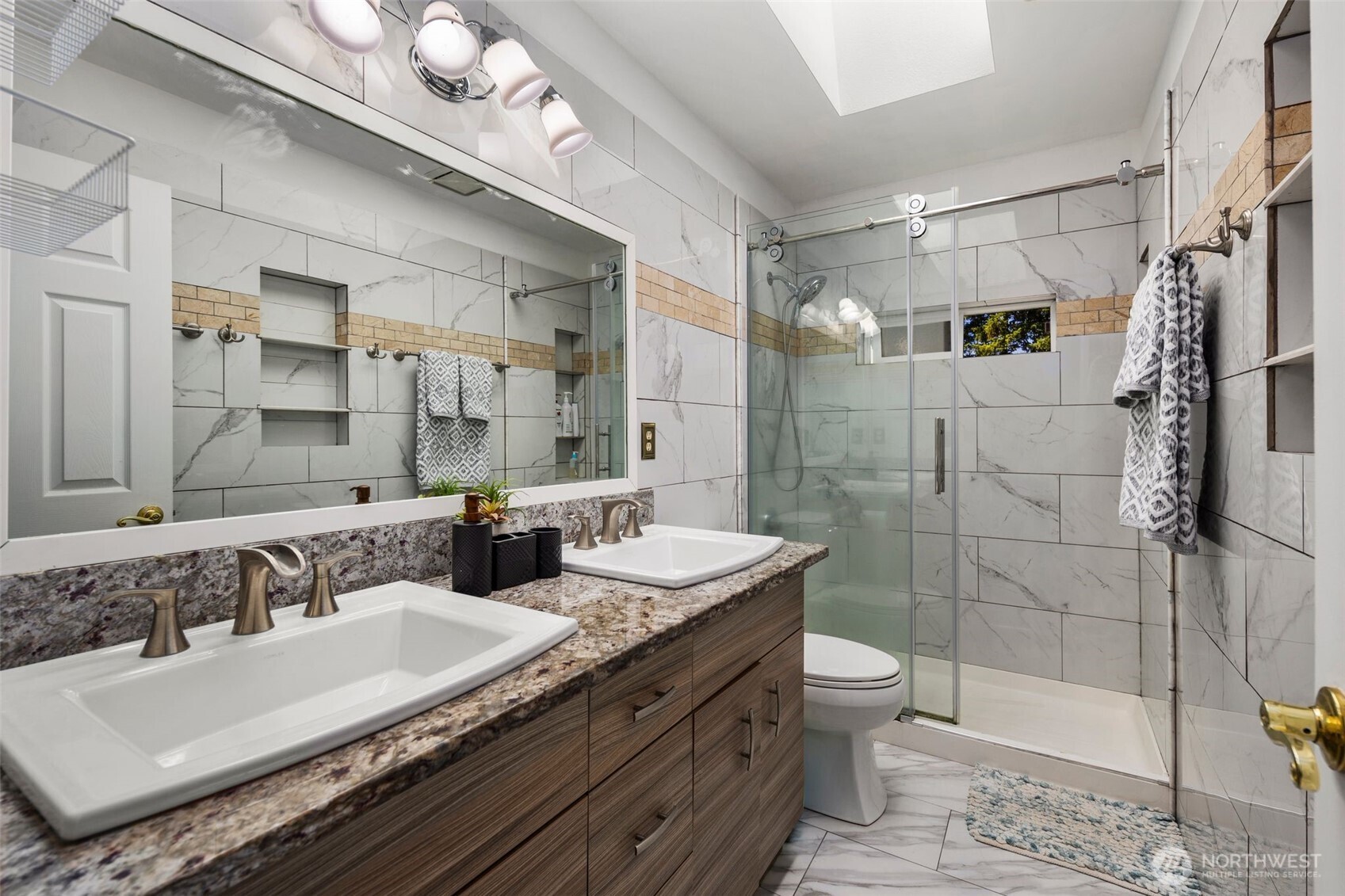 14015 Southeast 156th Court Renton, WA 98058 - Photo 28 of 36 a bathroom with a granite countertop double vanity sink toilet and shower