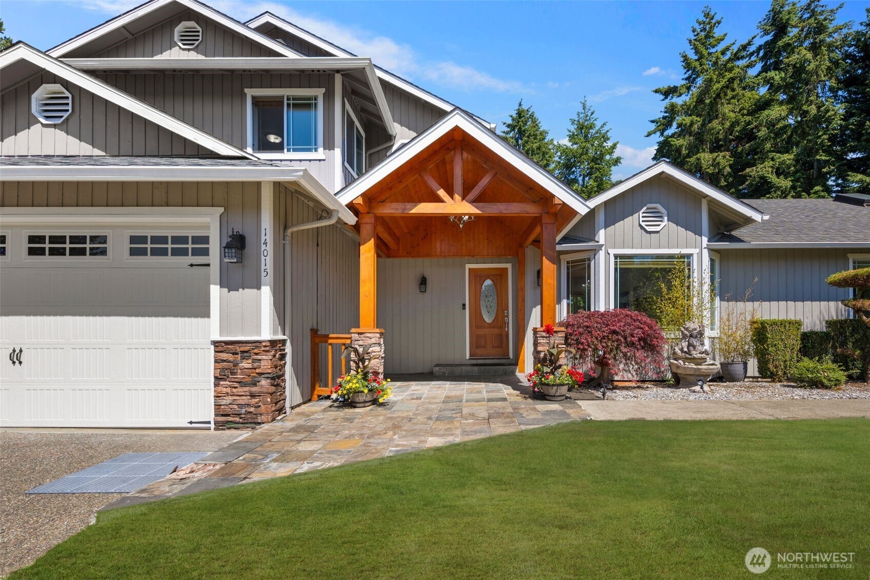14015 Southeast 156th Court Renton, WA 98058 - Photo 3 of 36 a front view of a house with yard and green space