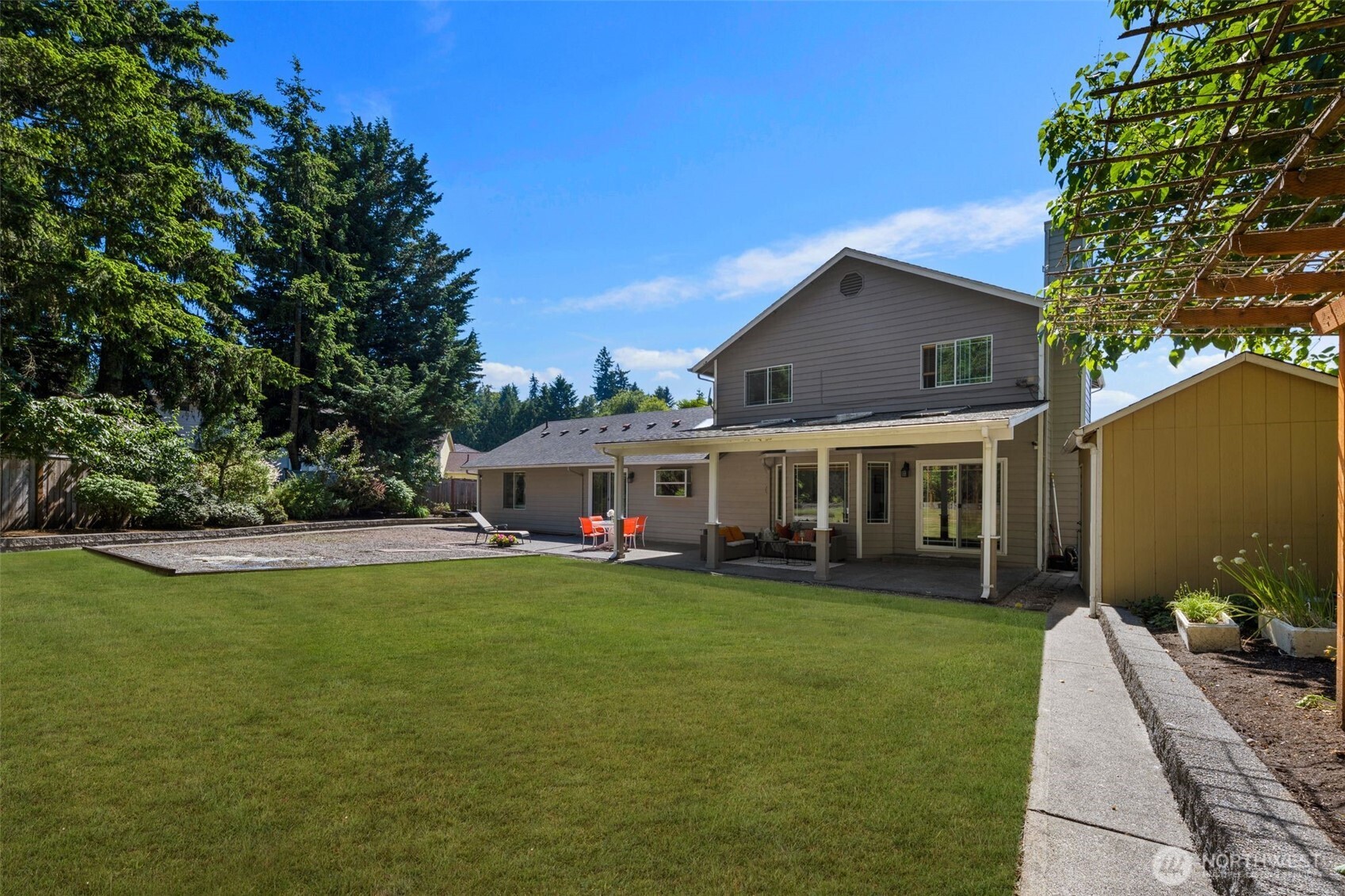 14015 Southeast 156th Court Renton, WA 98058 - Photo 34 of 36 a view of a house with a yard and sitting area