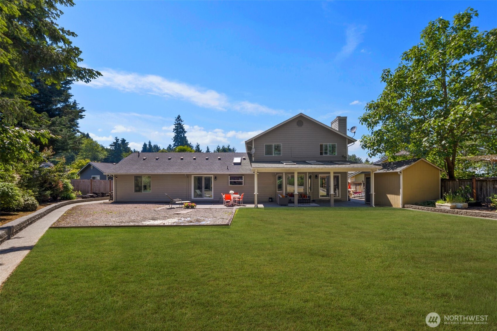 14015 Southeast 156th Court Renton, WA 98058 - Photo 35 of 36 a front view of a house with a garden