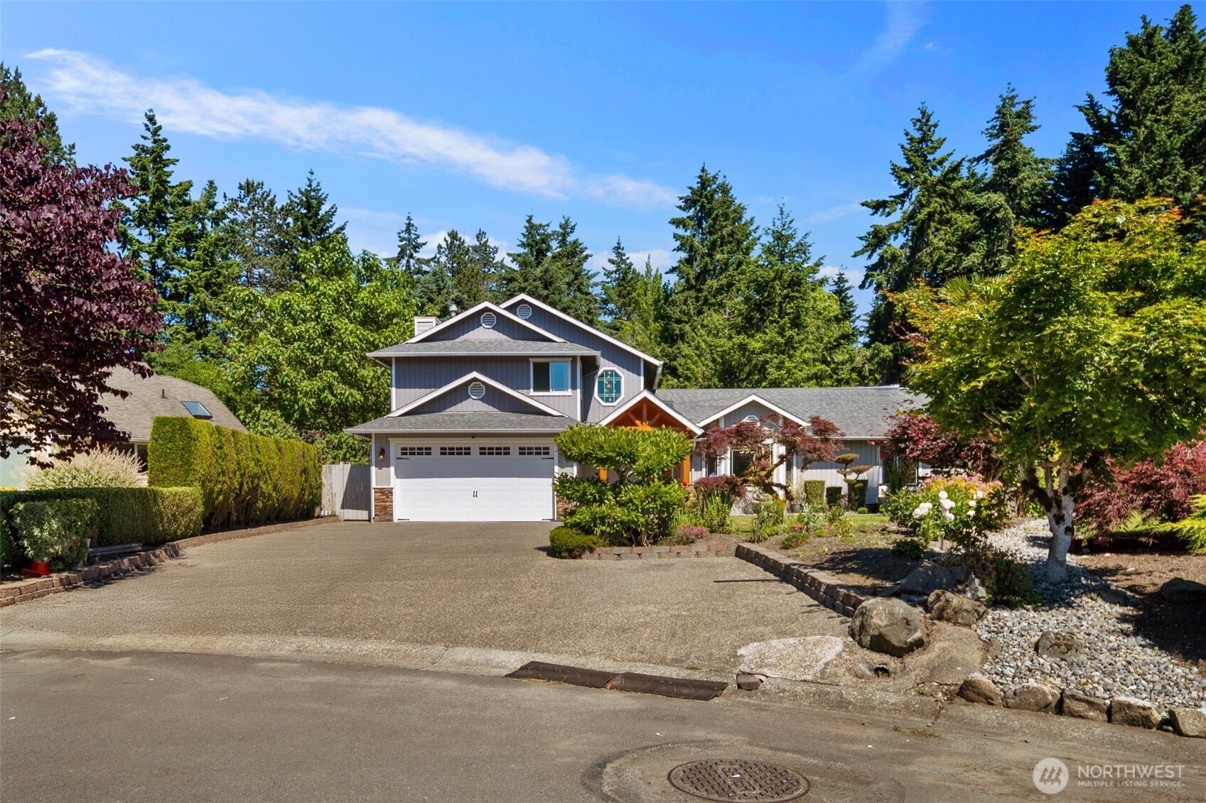 14015 Southeast 156th Court Renton, WA 98058 - Photo 36 of 36 a front view of a house with a yard and garage