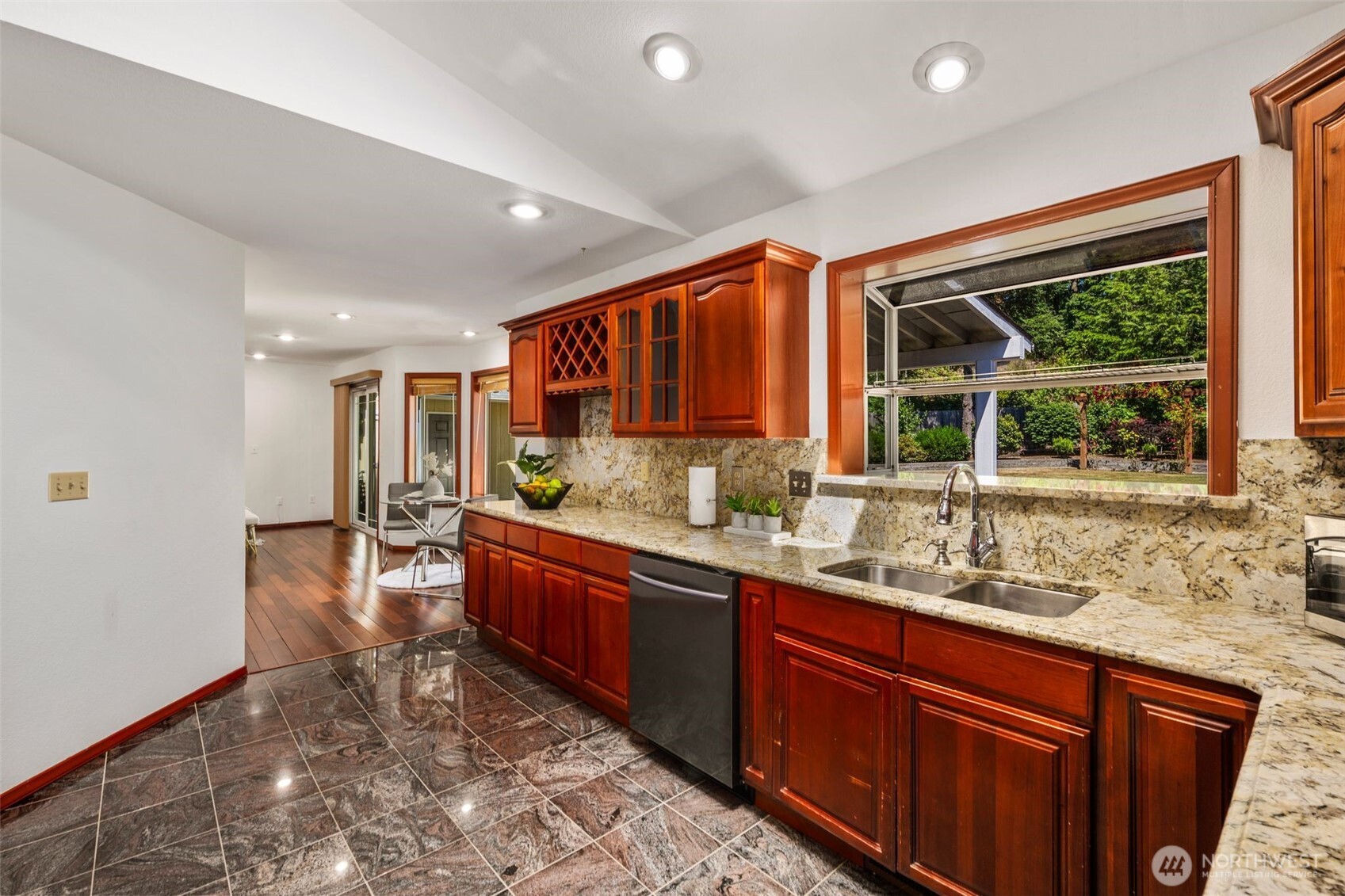 14015 Southeast 156th Court Renton, WA 98058 - Photo 10 of 36 a kitchen with stainless steel appliances granite countertop sink stove and granite counter top